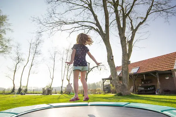 A young girl on trampoline