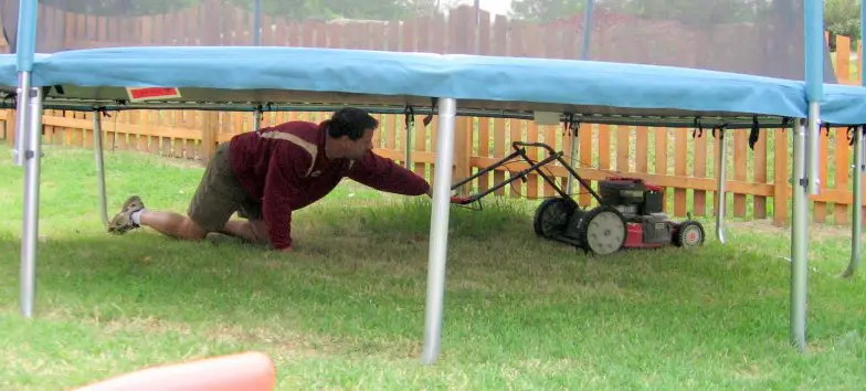 mowing Grass Under a Trampoline